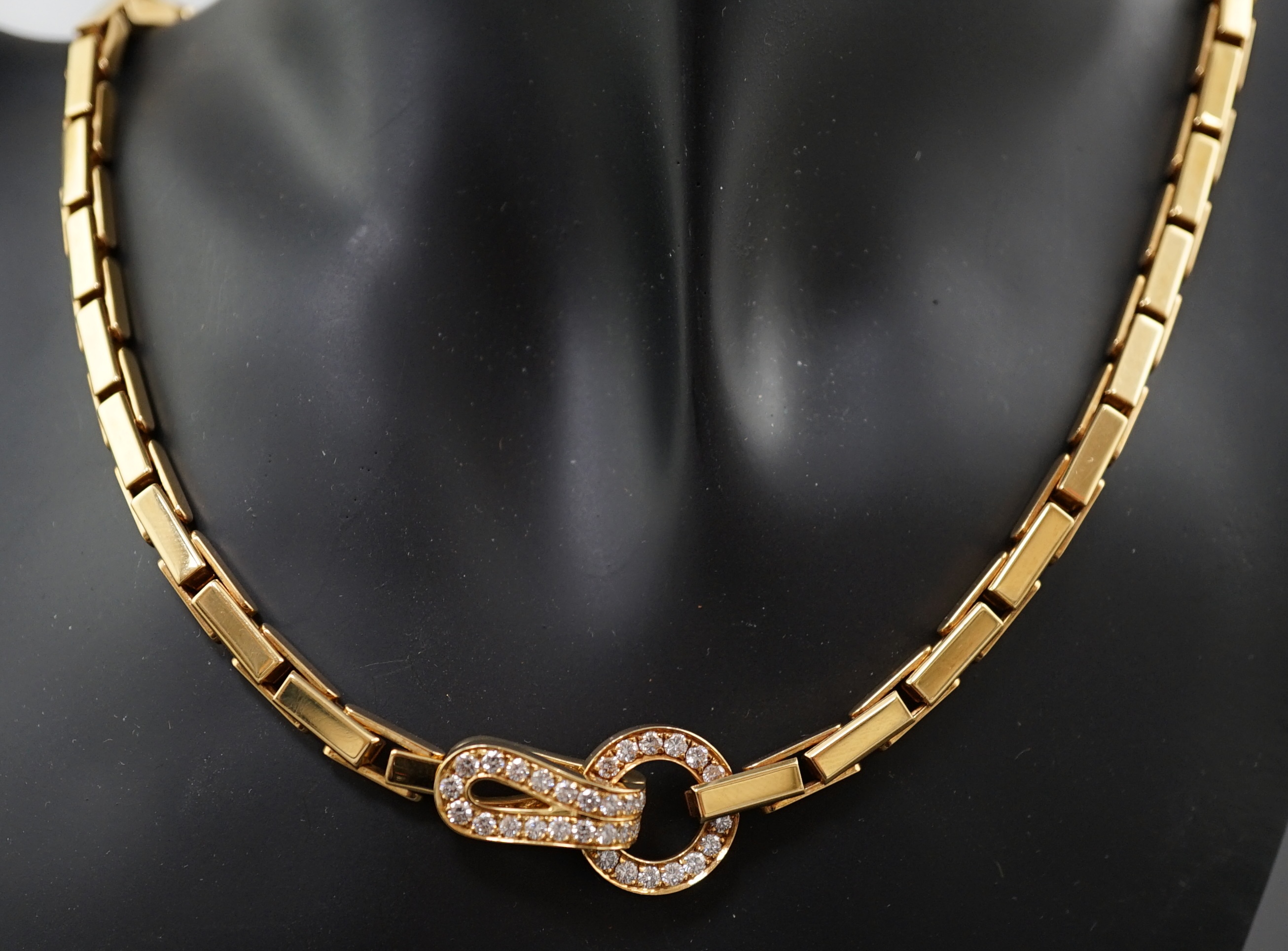 A modern Cartier 18ct gold necklace, with diamond cluster set clasp